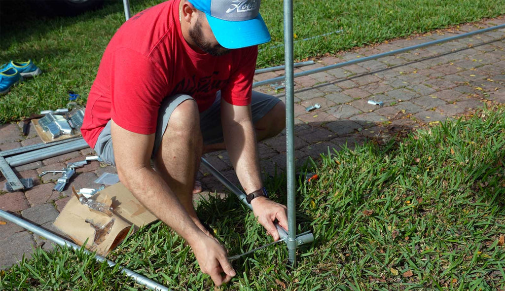 man building a diy pipe project with conduit