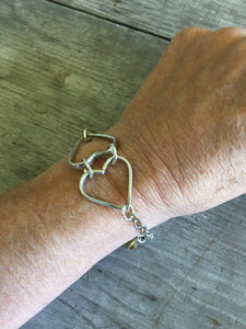 Heart Bracelet made from Upcycled Silverware Fork tines Shown on Wrist