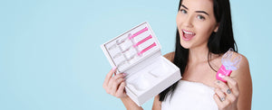 Woman with a premium teeth whitening kit and bright teeth.