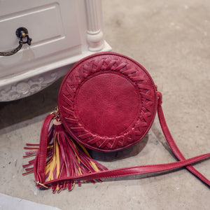 round woven crossbody bag