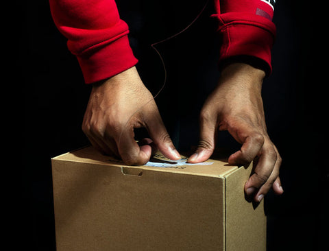 package being prepared to be shipped with free domestic shipping