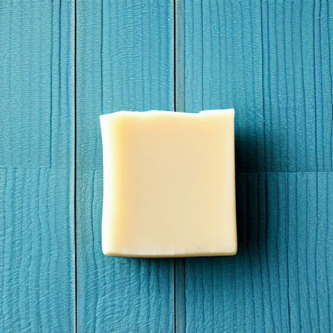 handmade soap bar on blue painted wood