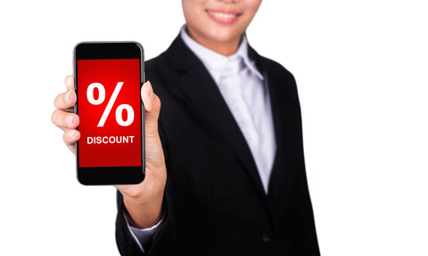 smiling person showing percent discount sign on phone