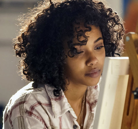 young black woman with curly hair