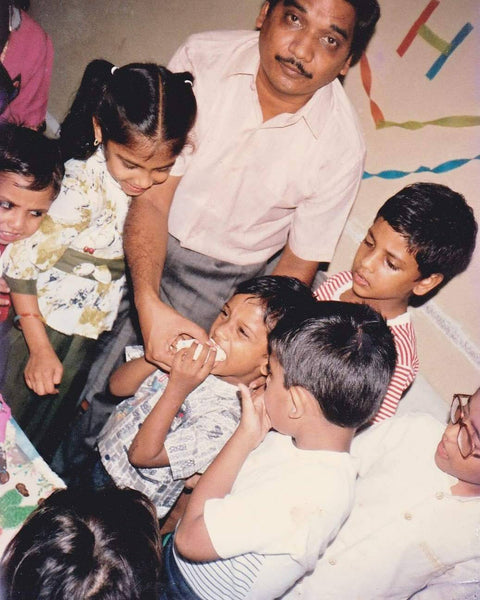 A childhood photo of Madhu Chocolate CEO and co-founder Harshit Gupta and his family gathering together in India.