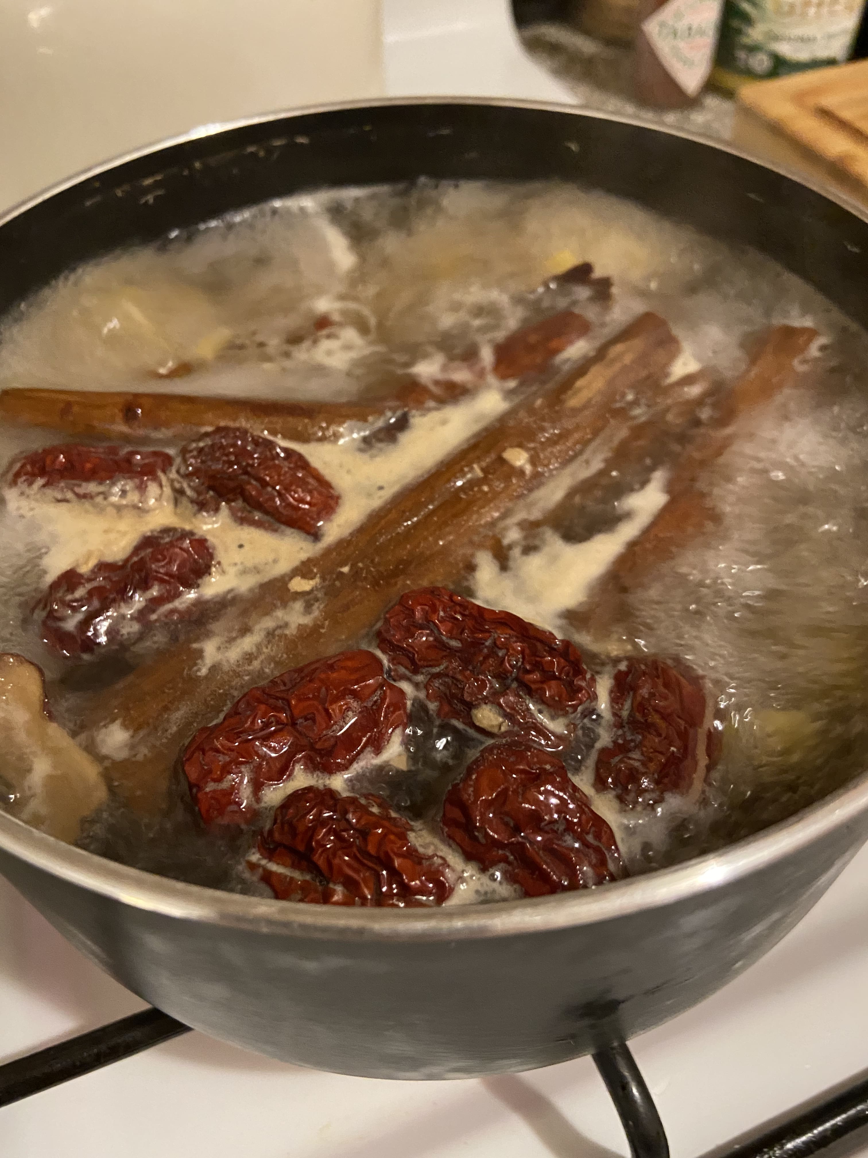 A pot of boiling ingredients for recipe testing iterations of Halmi sparkling beverages.