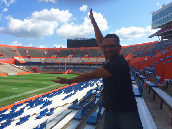 A photo of Madhu Chocolate CEO and co-founder Harshit Gupta at the University of Florida's football stadium.