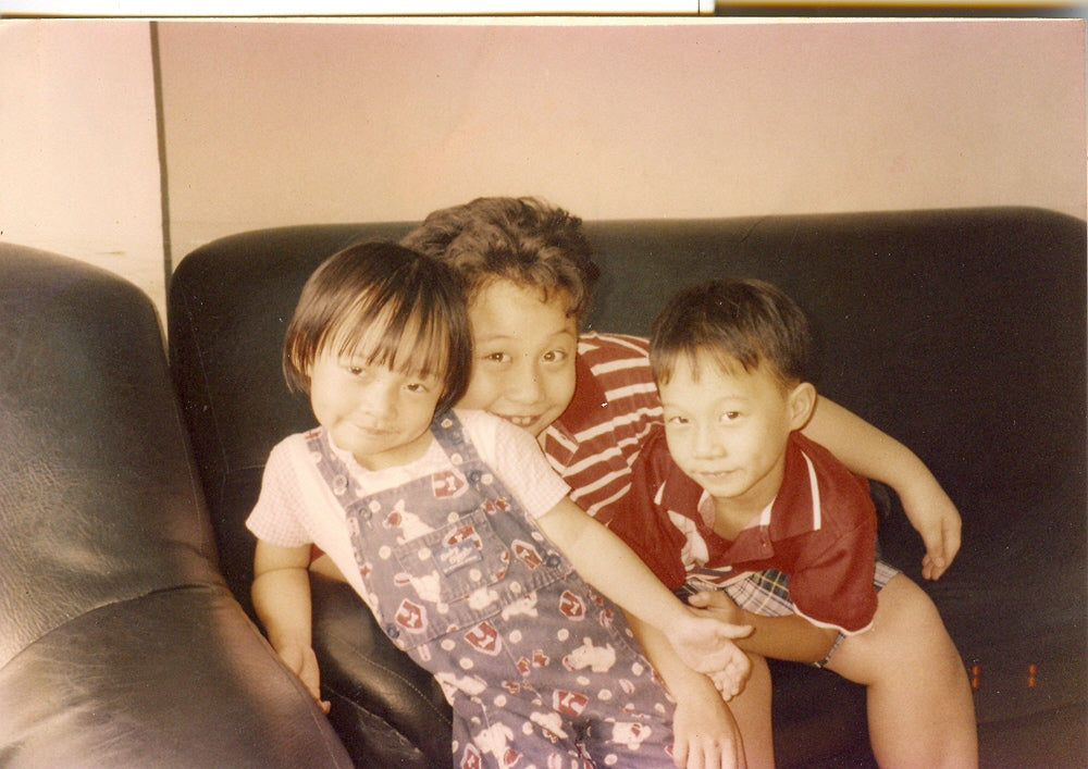 An old photo of Gino Chua, the founder of Pika Pika Filipino spreads, with his siblings on the couch when they were kids