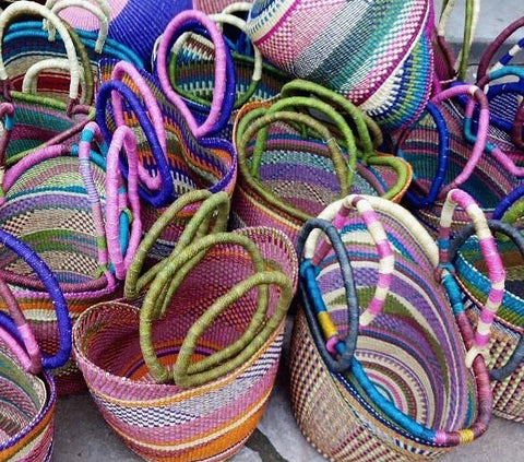 Colourful baskets stacked together.