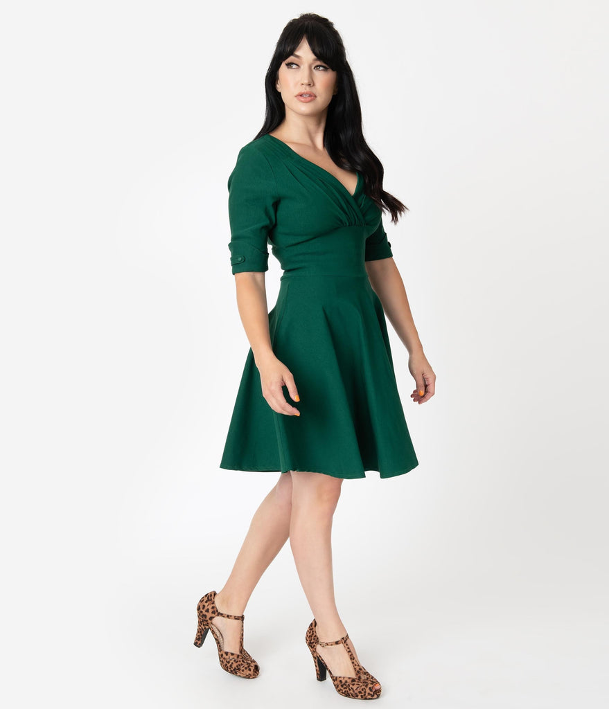 green fit and flare dress with sleeves