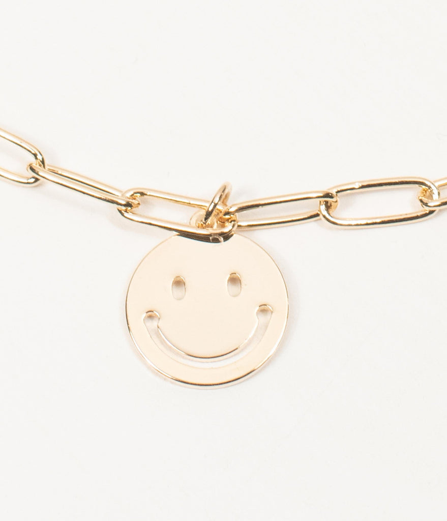 gold smiley face pendant