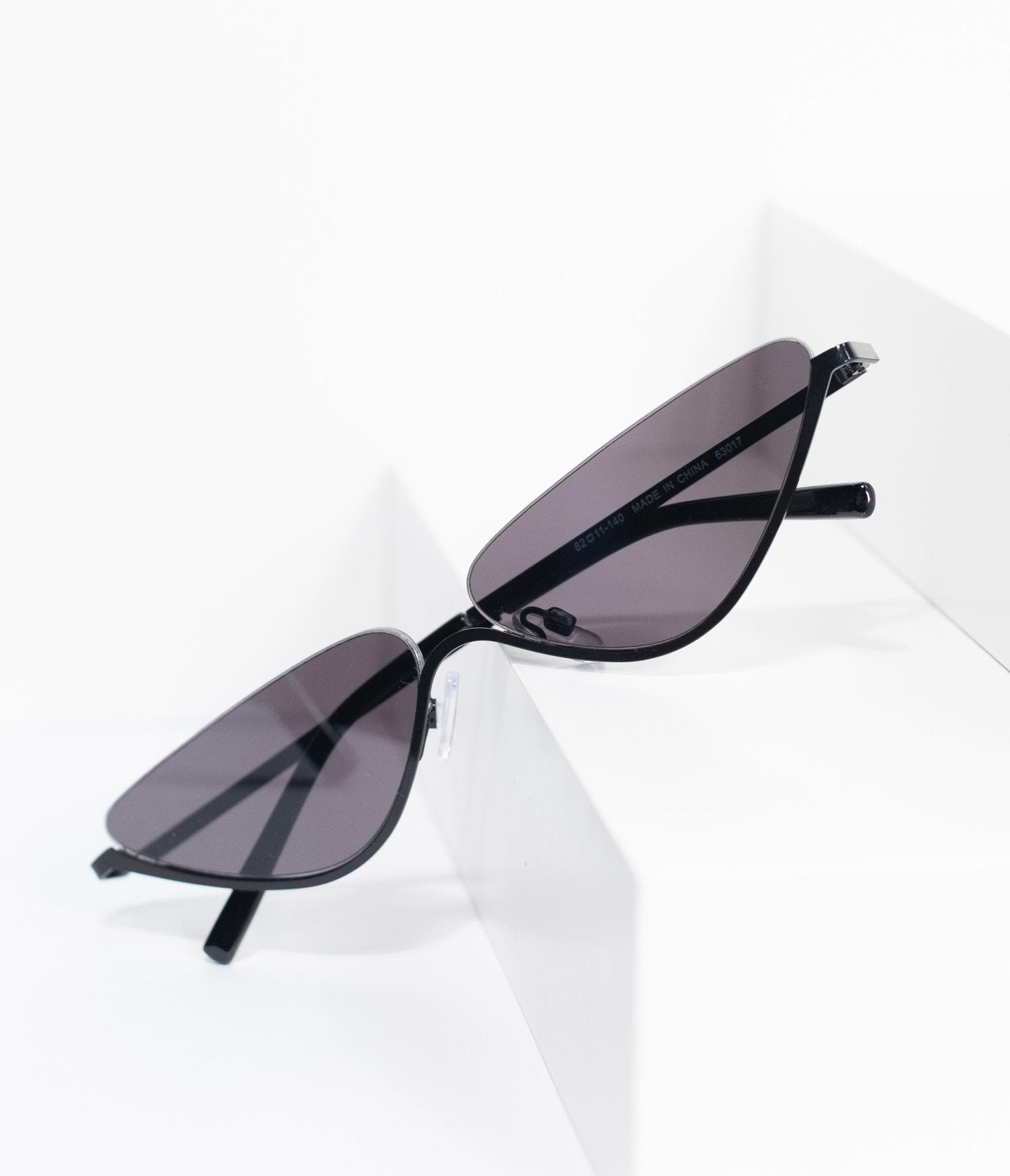 

Black Half Frame Intrigue Skinny Cat Eye Sunglasses