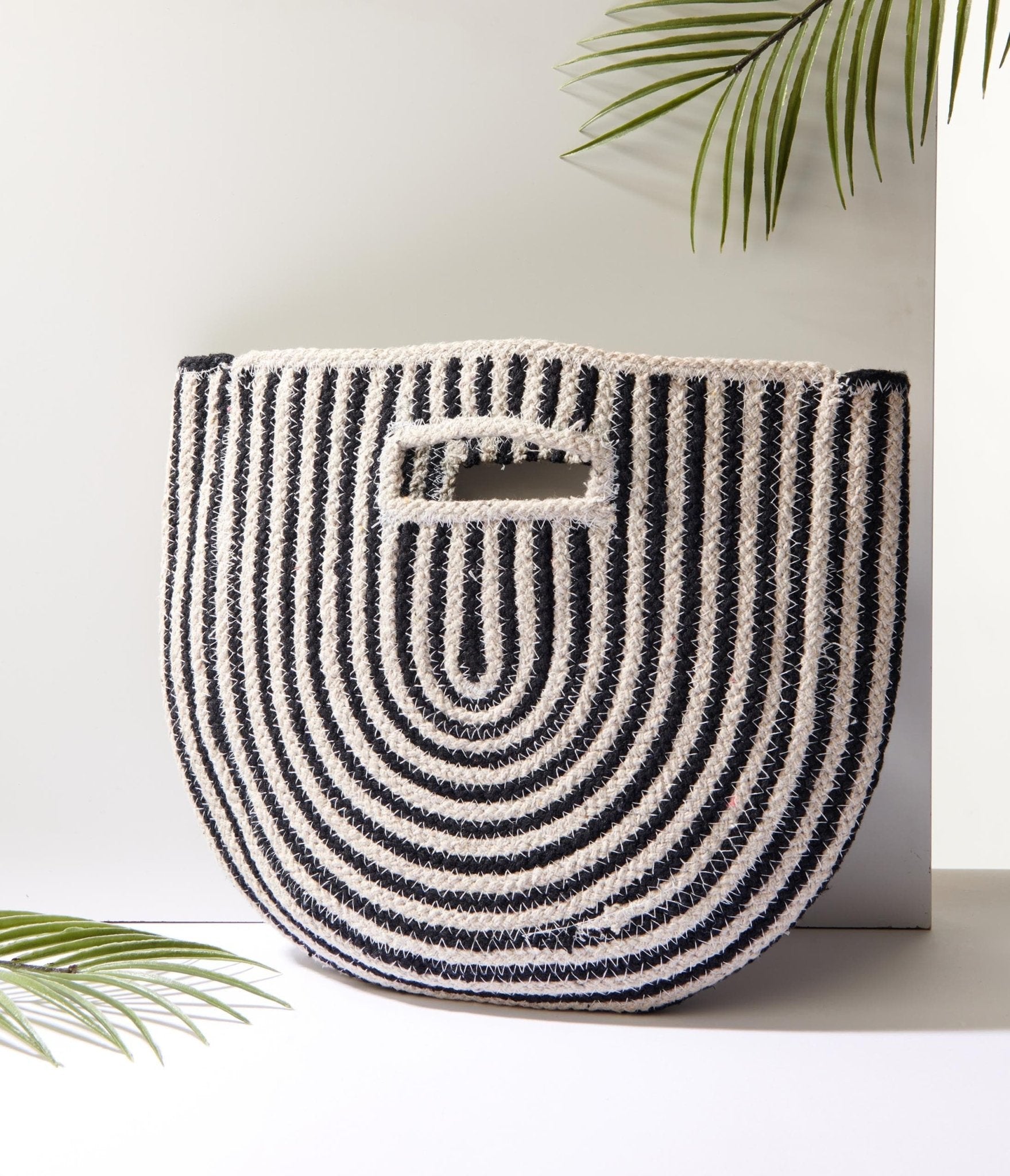 https://cdn.shopify.com/s/files/1/2714/9310/products/black-ivory-striped-half-circle-handbag-347247.jpg?v=1703093748