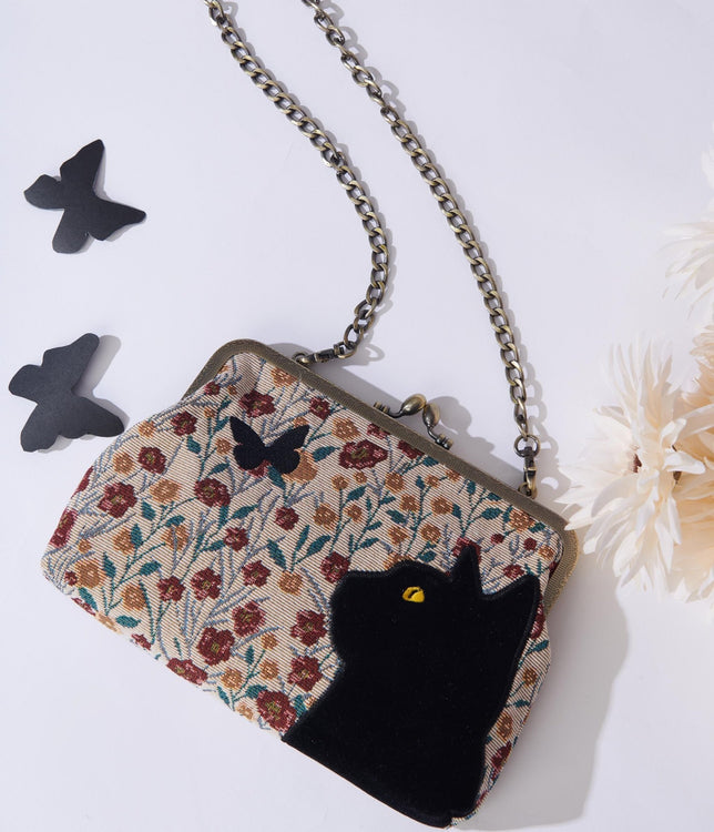 https://cdn.shopify.com/s/files/1/2714/9310/products/floral-black-cat-handbag-773110_750x750.jpg?v=1703095336