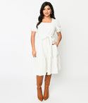 Sophisticated Elasticized Tie Waist Waistline Fitted Pocketed Smocked Square Neck Puff Sleeves Sleeves Above the Knee Fit-and-Flare Dress With a Sash