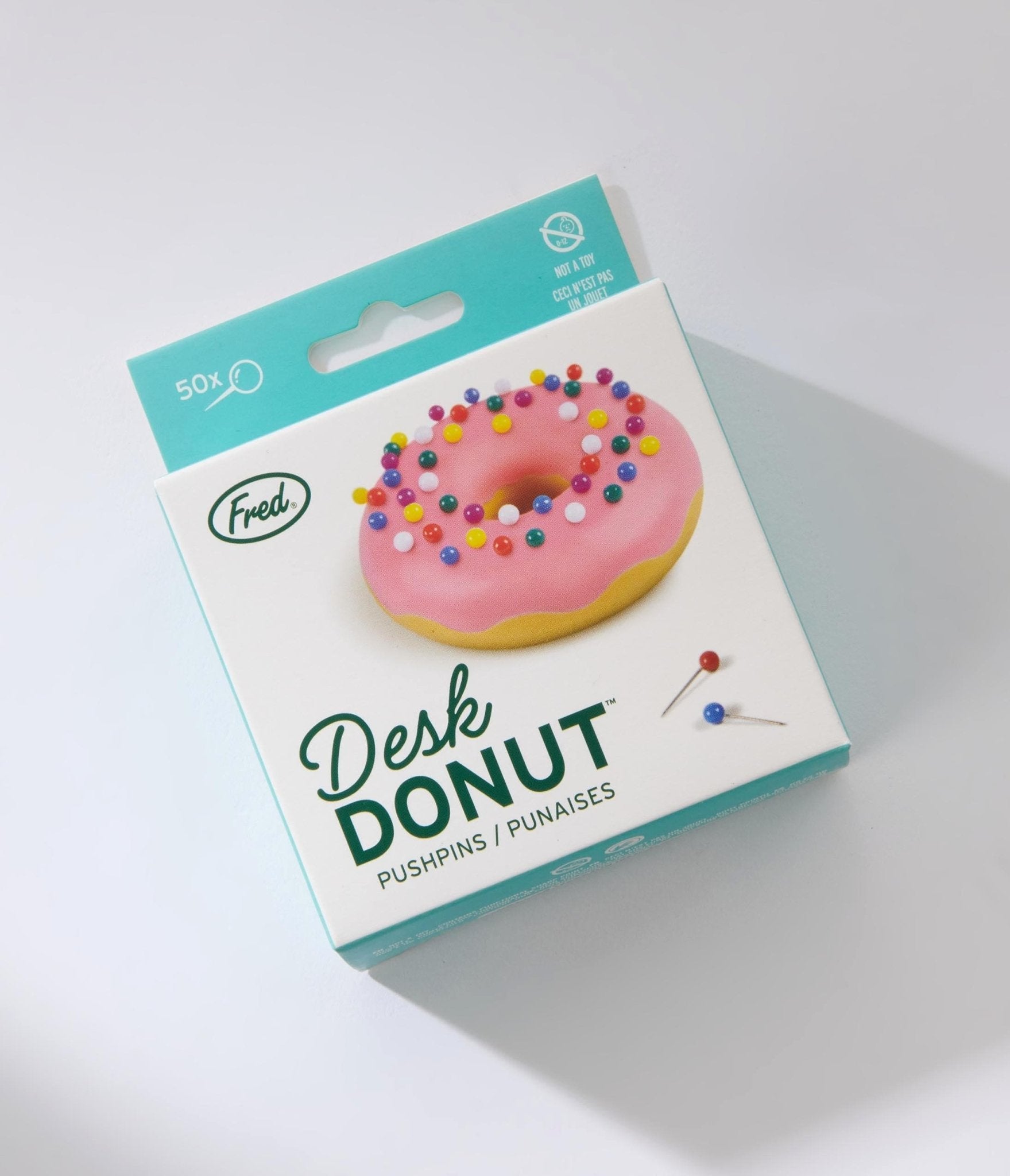 https://cdn.shopify.com/s/files/1/2714/9310/products/pink-desk-donut-411383.jpg?v=1703096647