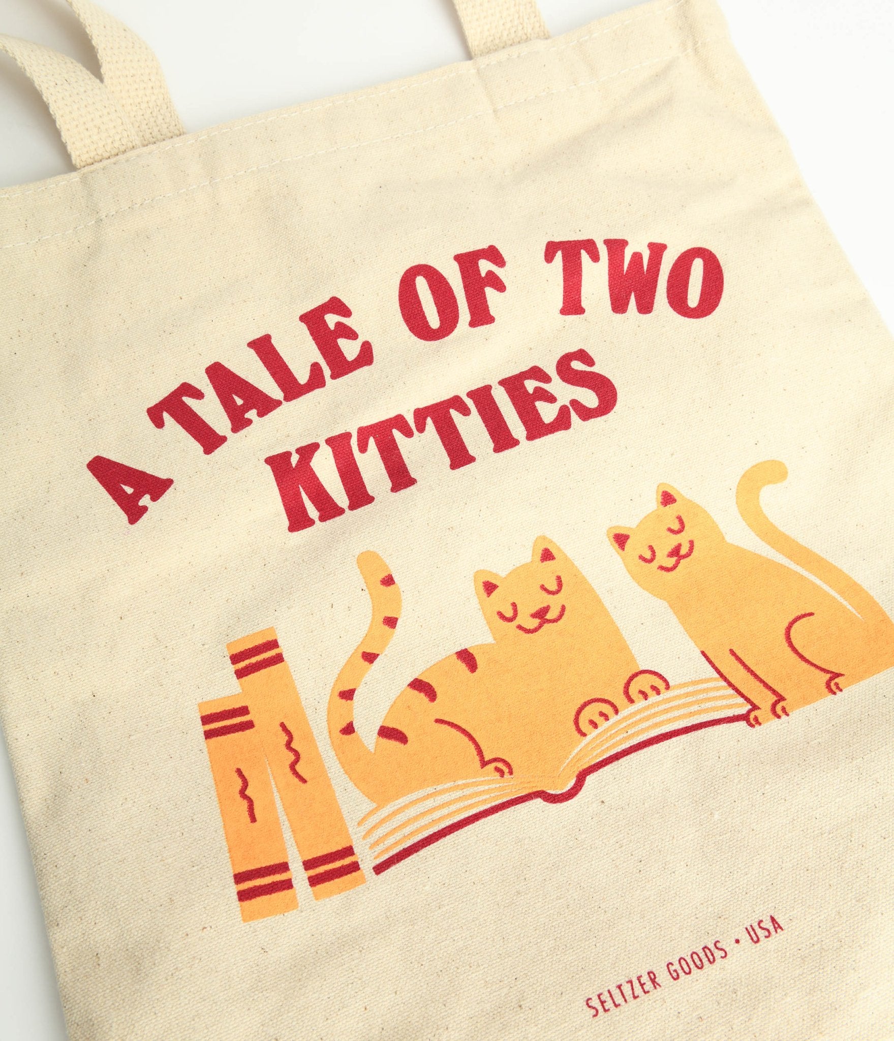 https://cdn.shopify.com/s/files/1/2714/9310/products/tale-of-two-kitties-canvas-tote-bag-780953.jpg?v=1703098195