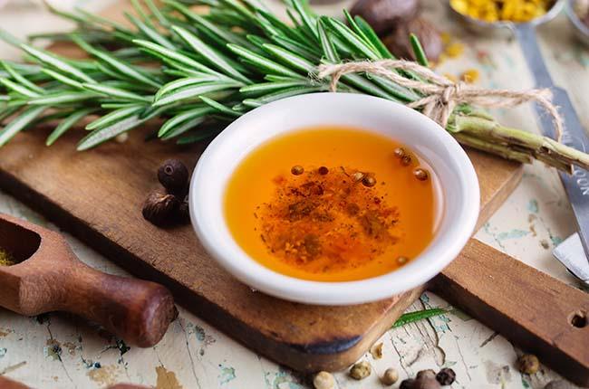 olive oil with spices and herbs, close-up