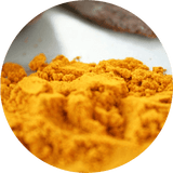 orange turmeric powder pile