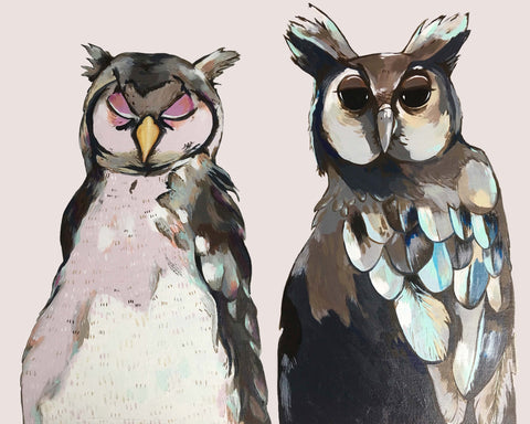 two grumpy old owls sitting next to one another