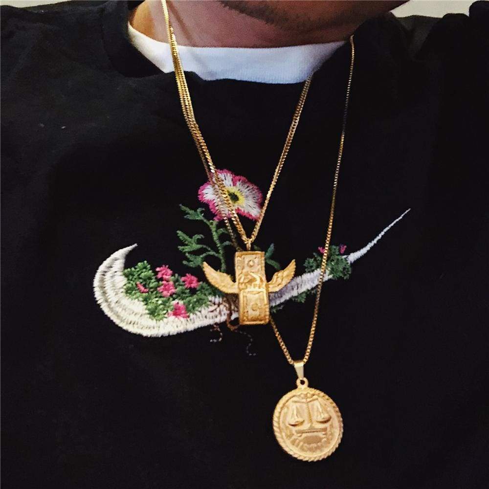 supreme justice gold pendant