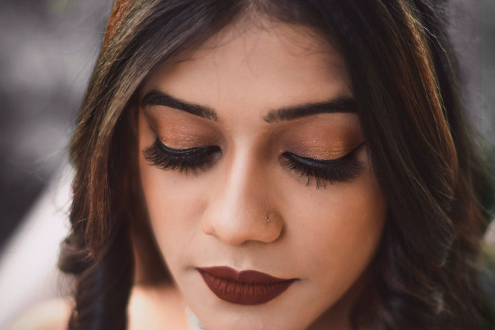 A Bride Wearing Glamorous Bridal Makeup with Eyes Closed