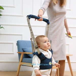 baby walking along furniture