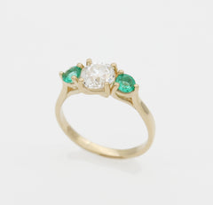 diamond emerald trilogy ring yellow gold