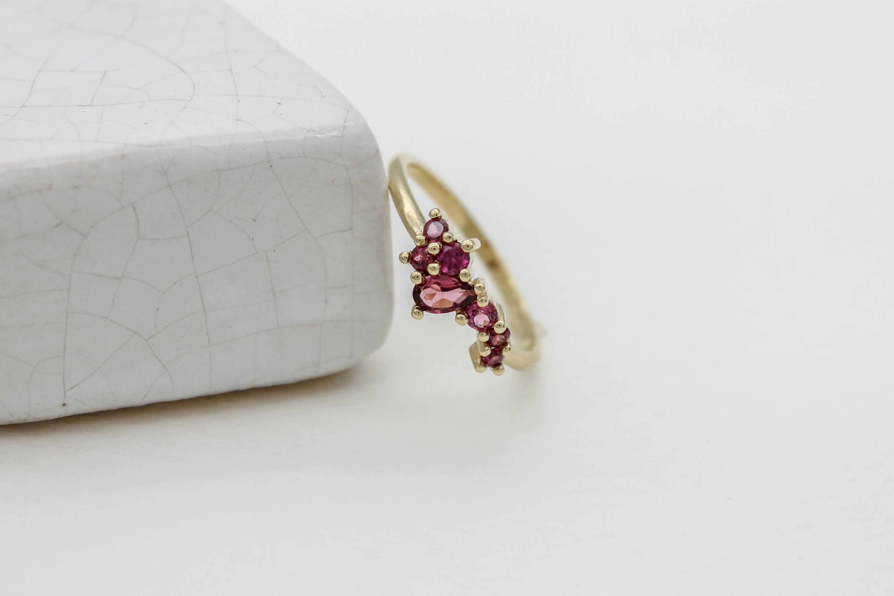 Garnet gemstones set in a custom gold ring.