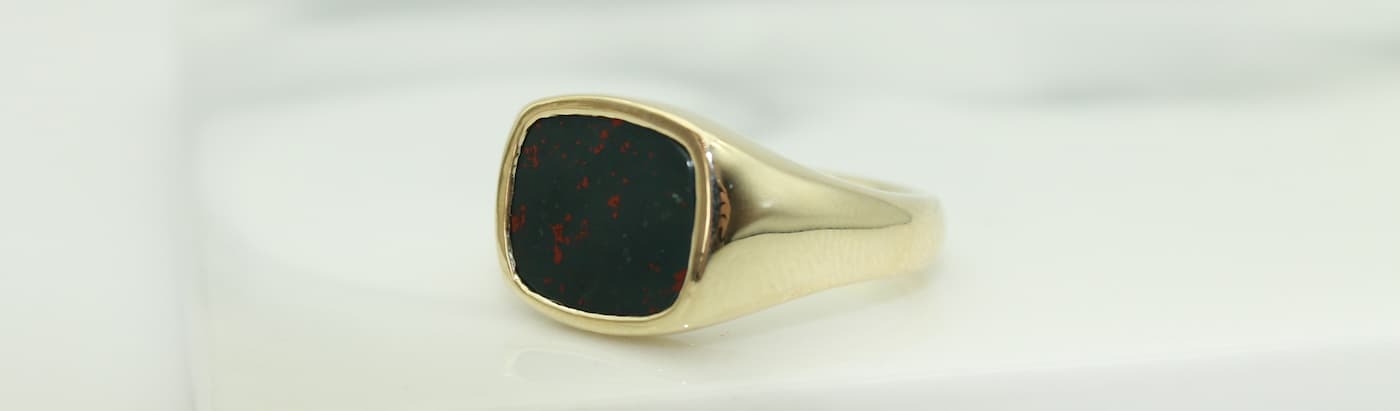 Blood Stone, March's birtstone, set in a gold signet ring.