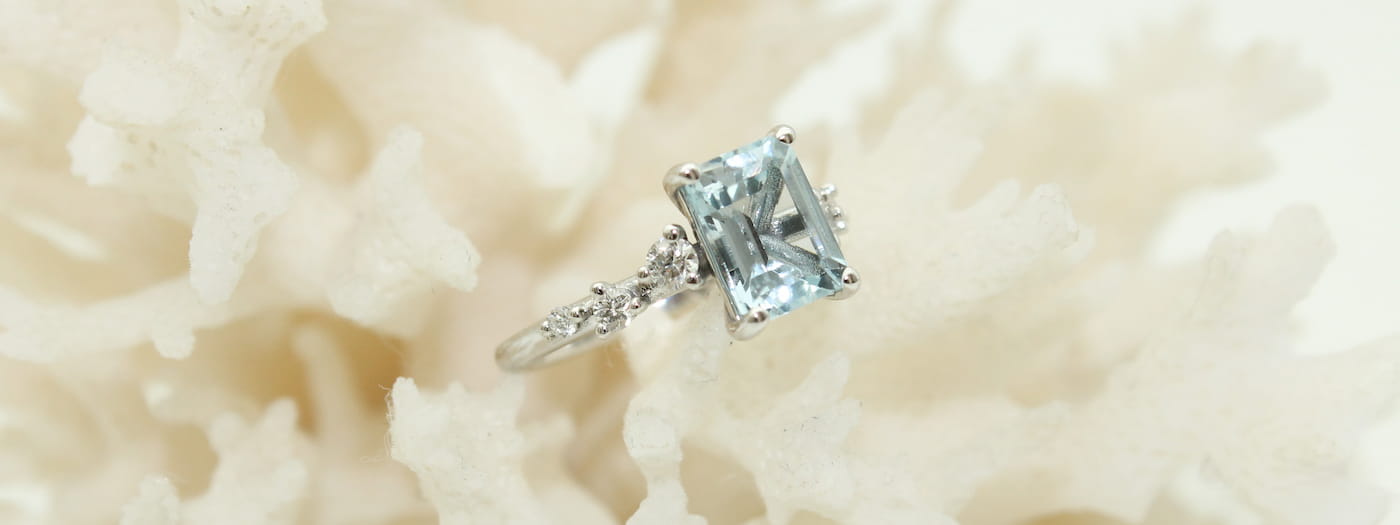 White Gold engagement ring with a centre set Aquamarine gemstone.