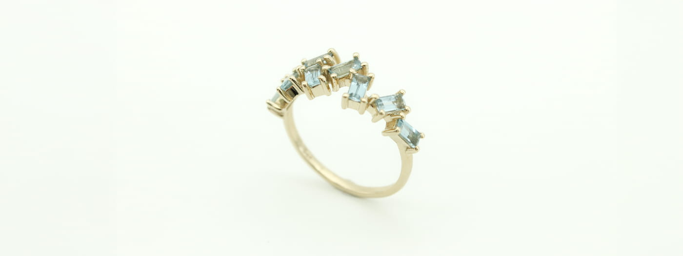 9ct gold Stack Ring set with a cluster of Aquamarine gemstone baguettes.