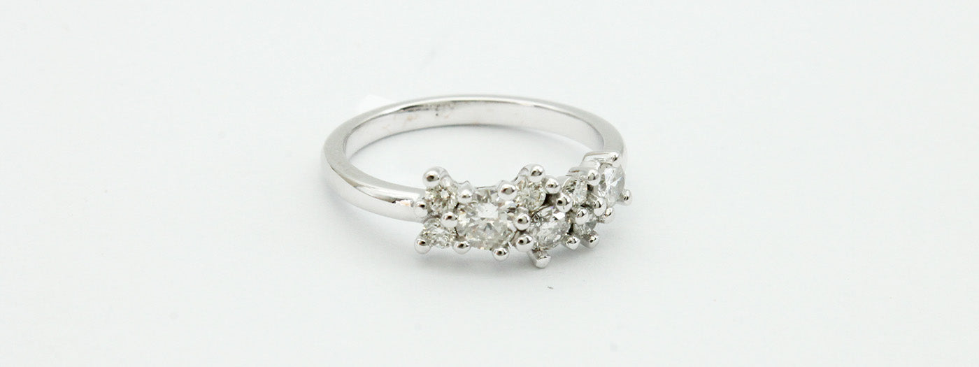 Custom diamond 9ct gold ring set with a constellation of small round diamonds.