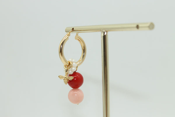 Tiny bee, half moon, and shell coral & pink jade charms on a set of Mama Hoop earrings.