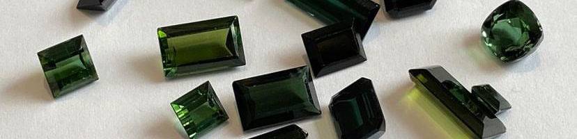 Tourmaline gemstones, the October birthstone, in a variety of shapes and colours.