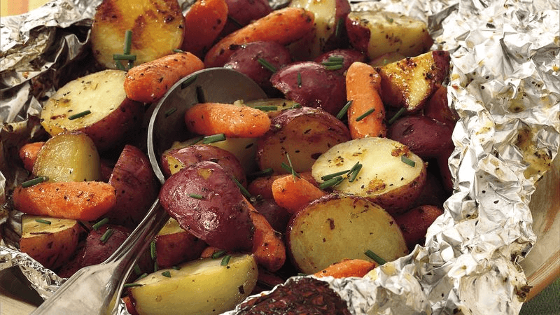 grilled potatoes and carrots in foil