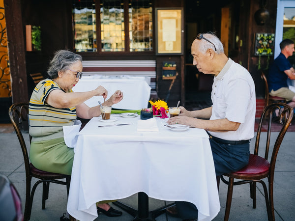old couple date eating in a restaurant