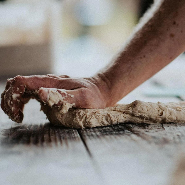 Kneading pizza dough