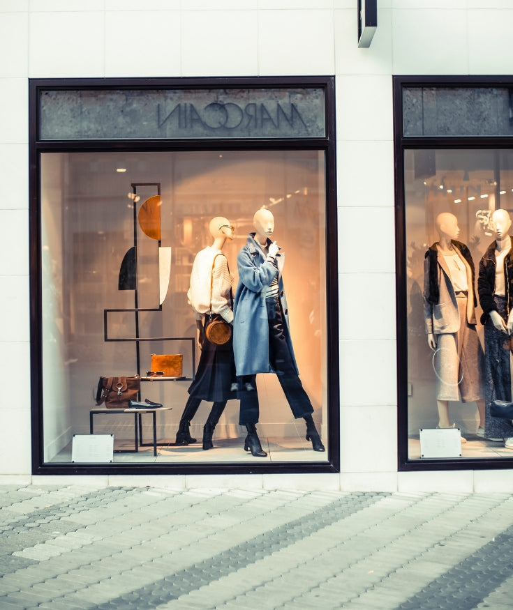 Fast fashion shop fronts with mannequins on the high street