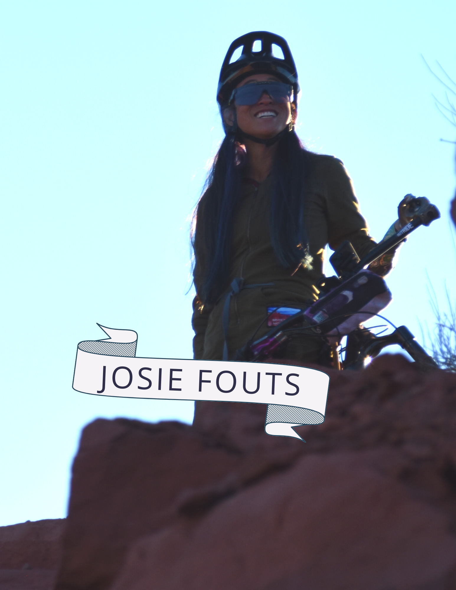 An Asian-American woman stands above a 300m descent with a huge grin on her face knowing that she is about to spend the whole day riding her adaptive hardtail mountain bike with a cycling prosthetic on her left arm.  Credit: Dean Warren https://www.instagram.com/deanwarrenphotography/