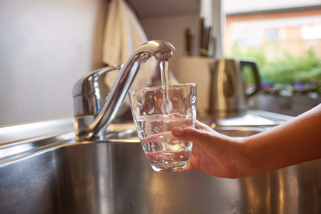 filling glass with water