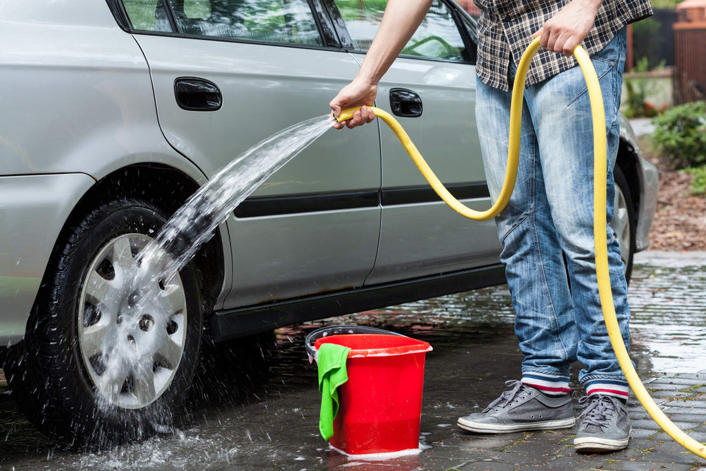 man washing car