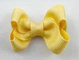 small 2 inch hair bow in light banana yellow