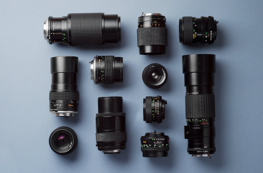 Camera lenses laid out on table