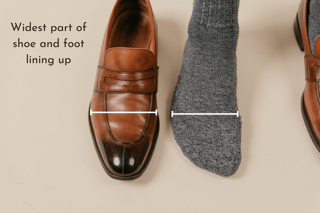 Dack's brown loafer shown to display sizing of foot next to it