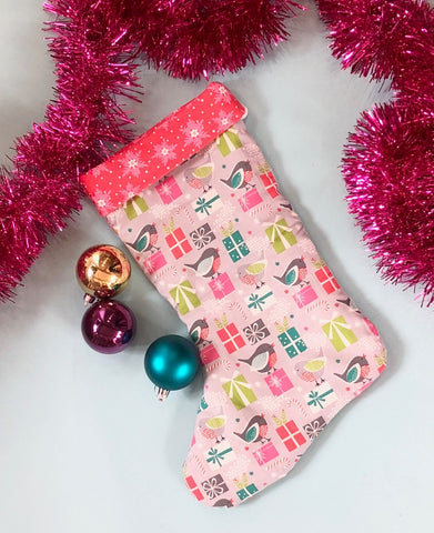 handmade christmas stocking with tinsle and bauble
