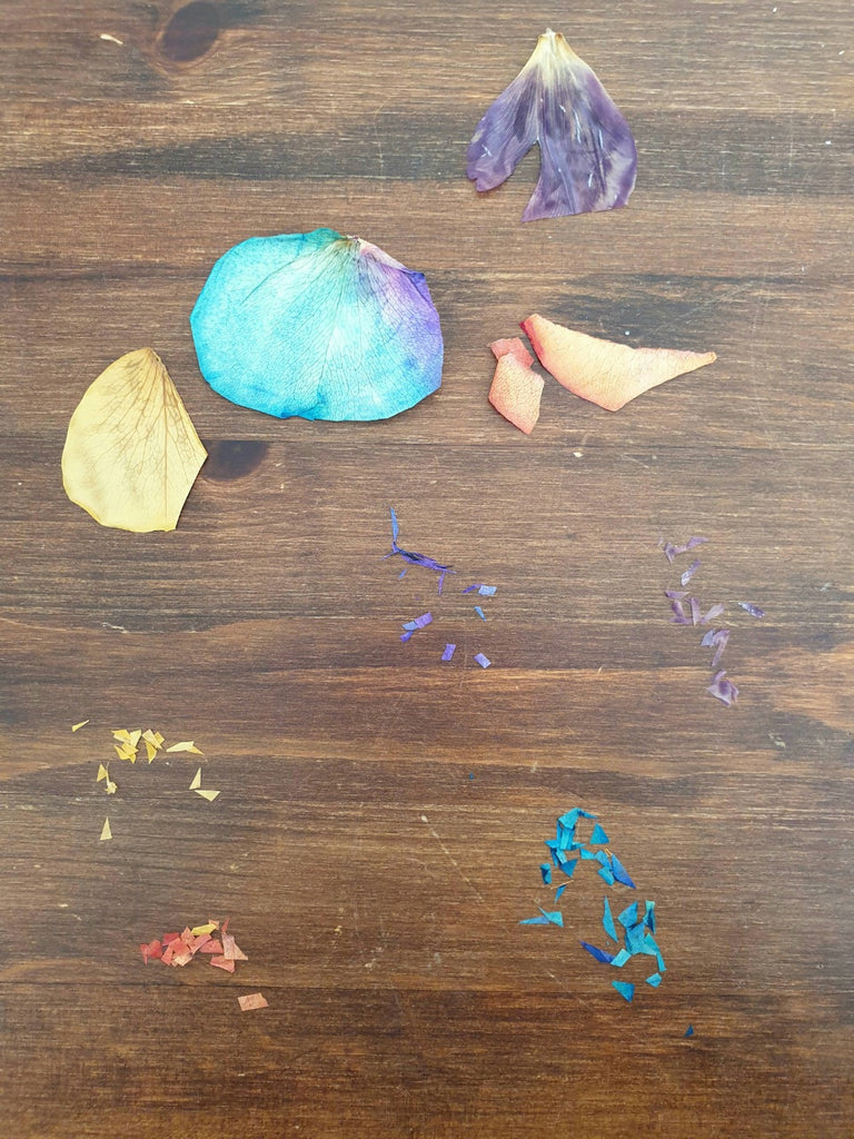 torn up flower petals on a wooden background