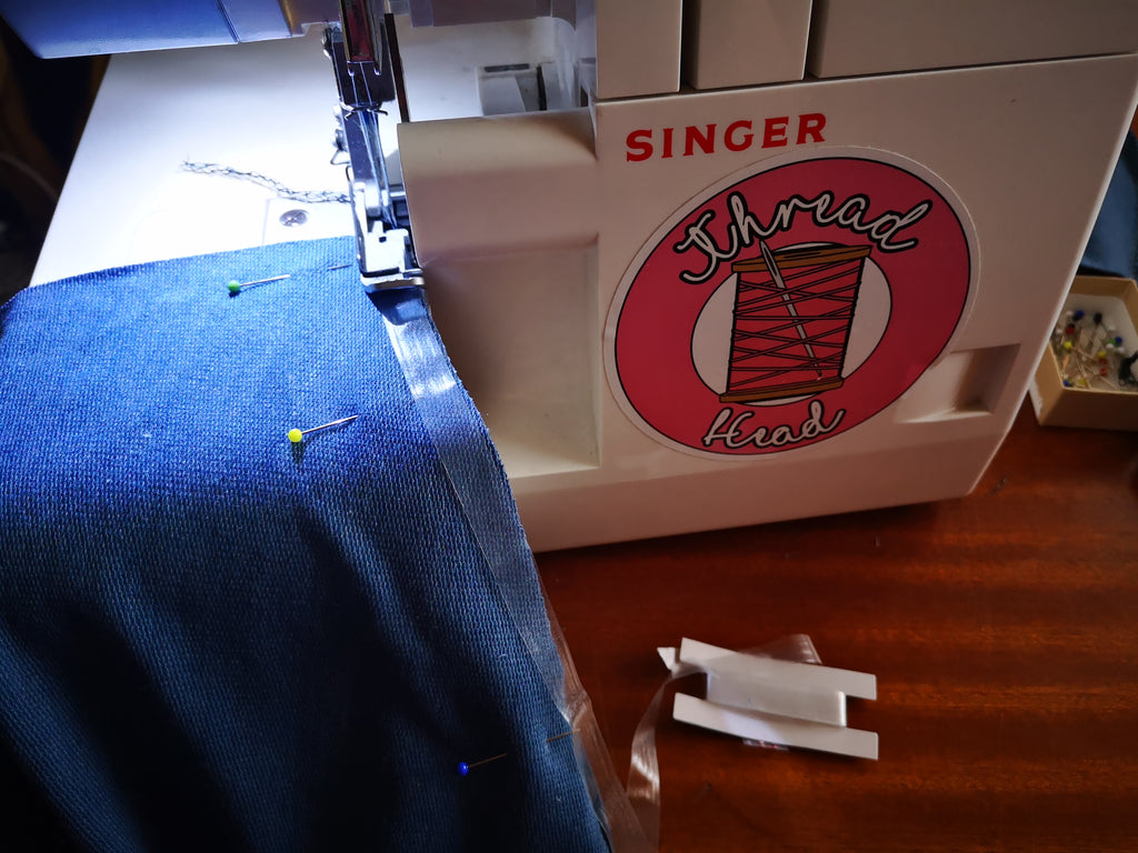 blue jersey and a sewing machine