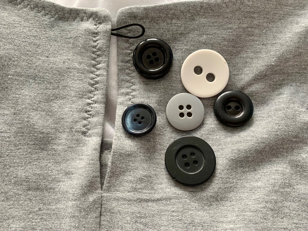 An array of buttons for the Everyday Amazing top