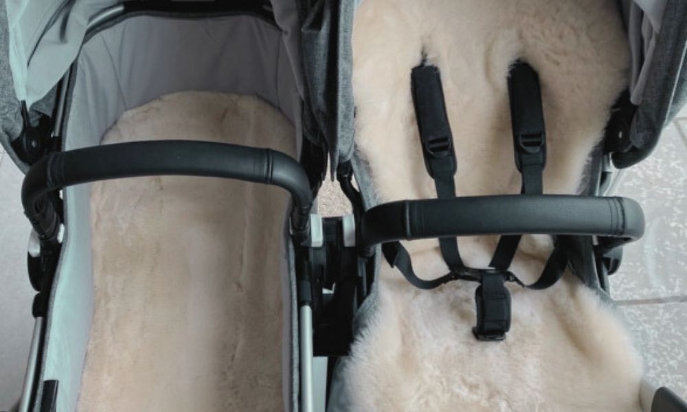 double buggy pram with two sheepskin liners